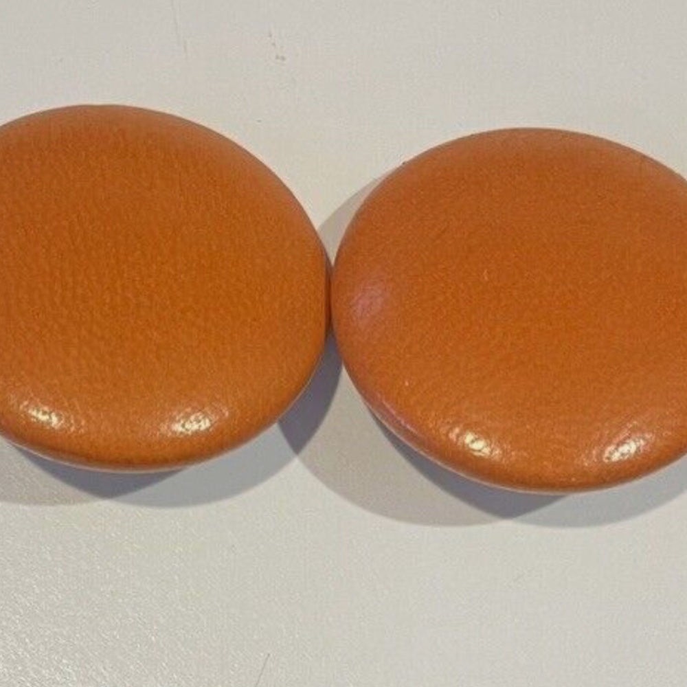 Vintage Charles Jourdan orange leather clip earrings